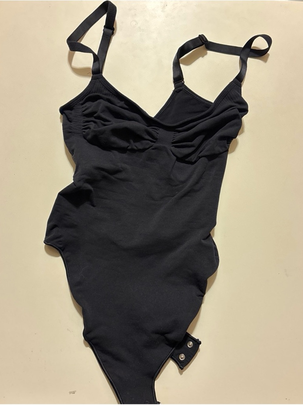 SKIMS Black One-Piece Bodysuit with Adjustable Straps